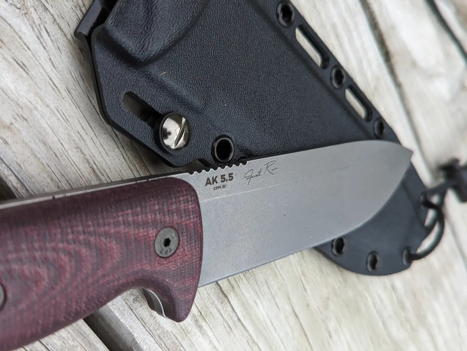Knife resting on wooden table
